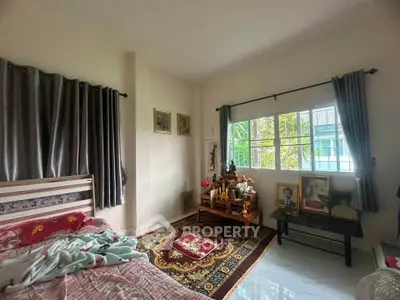 Cozy bedroom with natural light and traditional decor