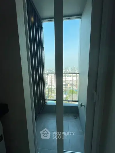 Compact balcony with city view in modern high-rise apartment