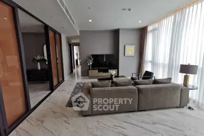 Spacious modern living room with elegant decor and large windows