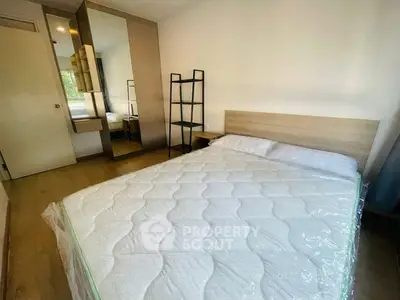 Cozy bedroom with modern furnishings and ample natural light