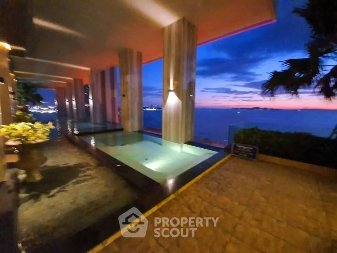 Luxurious rooftop pool with stunning sunset view and elegant design.