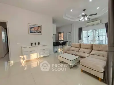 Spacious living room with modern decor and natural light