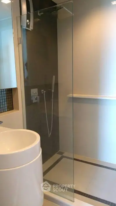 Modern bathroom with sleek glass shower and contemporary fixtures