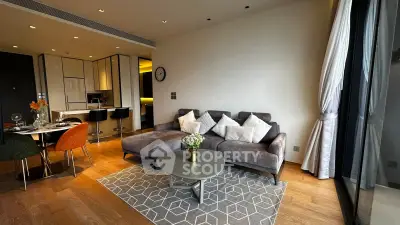 Modern living room with stylish decor and open kitchen layout