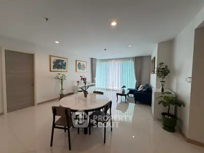 Spacious modern living room with elegant dining area and natural light