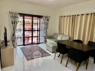 Spacious living room with modern furniture and large windows for natural light.