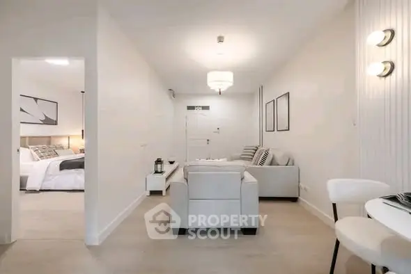 Modern living room with elegant decor and cozy seating in a stylish apartment