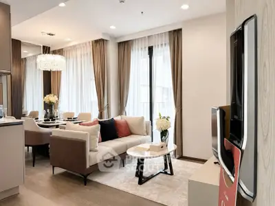 Luxurious modern living room with elegant decor and large windows in a high-end apartment.