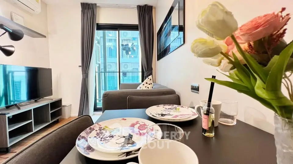 Modern living room with dining area and balcony view in stylish apartment