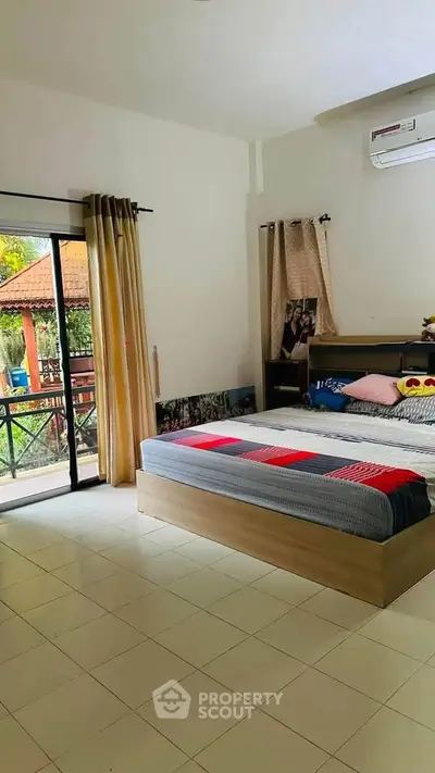 Spacious bedroom with garden view and modern decor