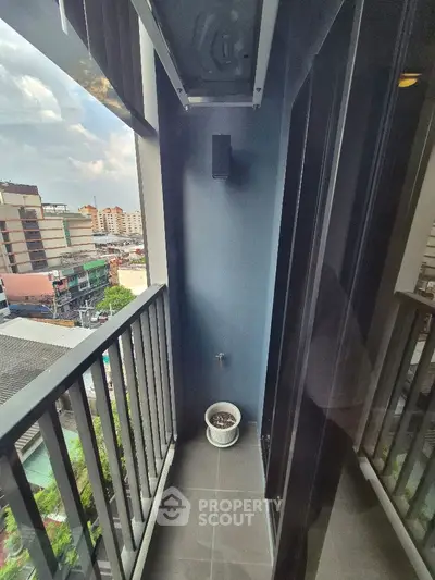 Charming urban balcony with city view, perfect for relaxation and enjoying the skyline.