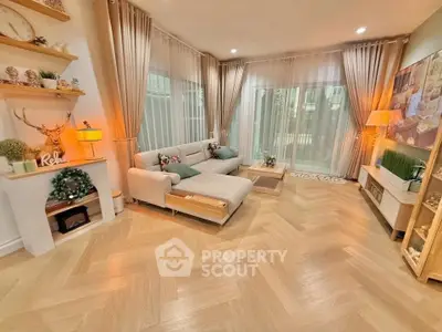 Spacious modern living room with elegant decor and large windows for natural light.