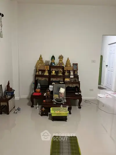 Spacious living area with traditional decor and polished flooring