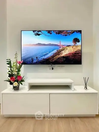 Modern living room with wall-mounted TV and stylish decor