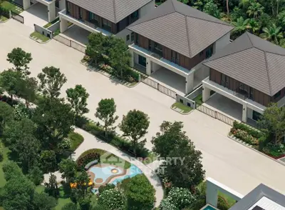Luxurious modern villas with landscaped gardens and spacious driveways in a serene neighborhood.