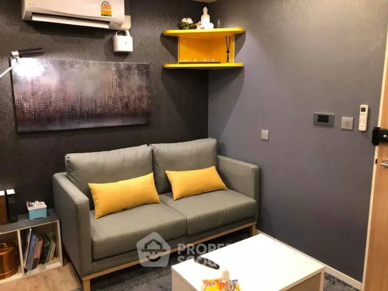 Cozy living room with modern decor, featuring a comfortable sofa, stylish artwork, and ambient lighting.
