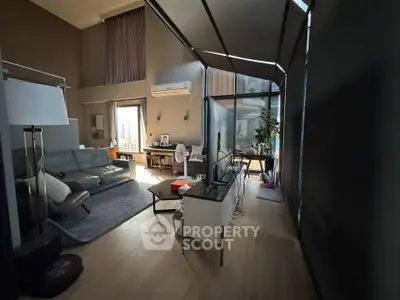 Spacious modern living room with high ceilings and stylish decor