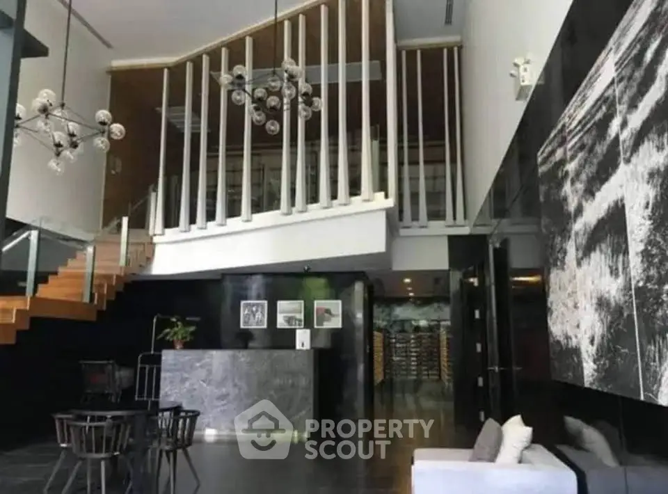 Luxurious modern lobby with stylish staircase and elegant decor