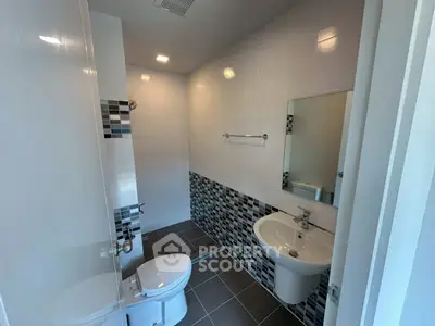 Modern bathroom with stylish tile design and sleek fixtures