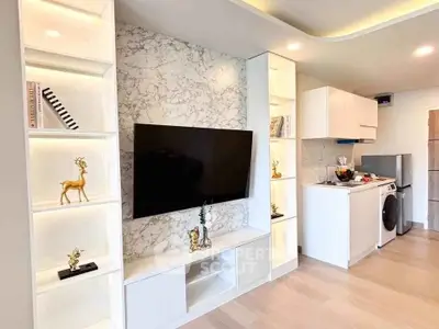 Modern living room with built-in shelves and marble accent wall