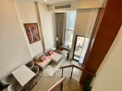 Stunning high-ceiling living room with modern decor and balcony view in luxury apartment.