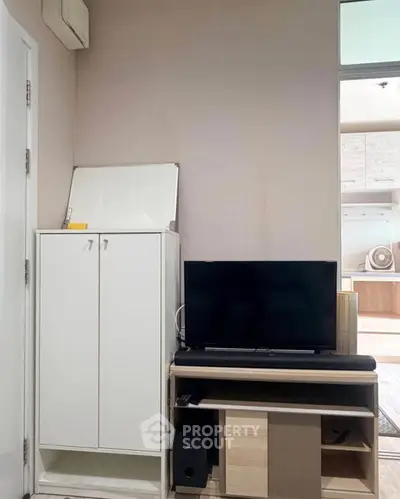 Modern living room with sleek TV setup and storage cabinet