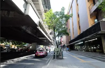 Modern urban street view with contemporary building and elevated road