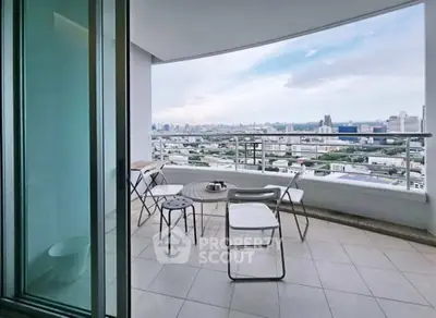 Stunning city view from a modern balcony with sleek furniture, perfect for relaxation and enjoying the skyline.