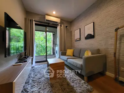 Modern living room with cozy sofa, wall-mounted TV, and balcony view in stylish apartment.