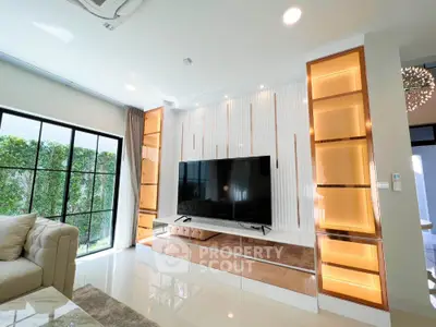 Luxurious living room with modern TV setup and elegant lighting