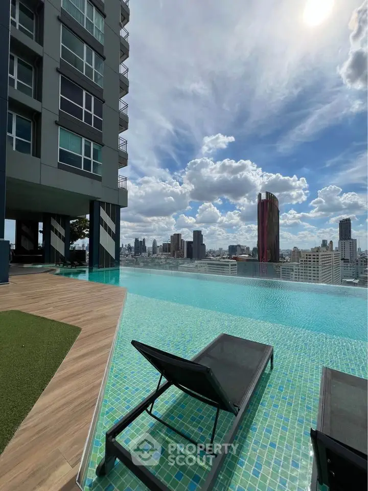 Stunning rooftop infinity pool with city skyline view in modern high-rise building