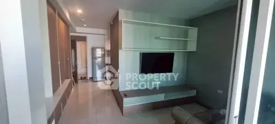 Modern living room with sleek TV unit and open layout, perfect for contemporary living.