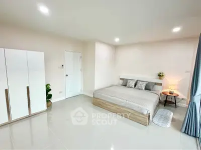 Spacious modern bedroom with minimalist design and elegant decor