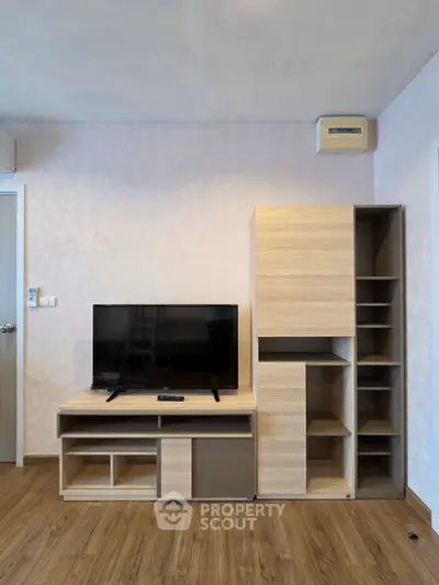 Modern living room with sleek wooden TV stand and storage unit