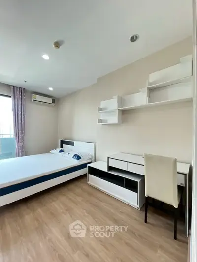Modern bedroom with stylish furniture and natural light