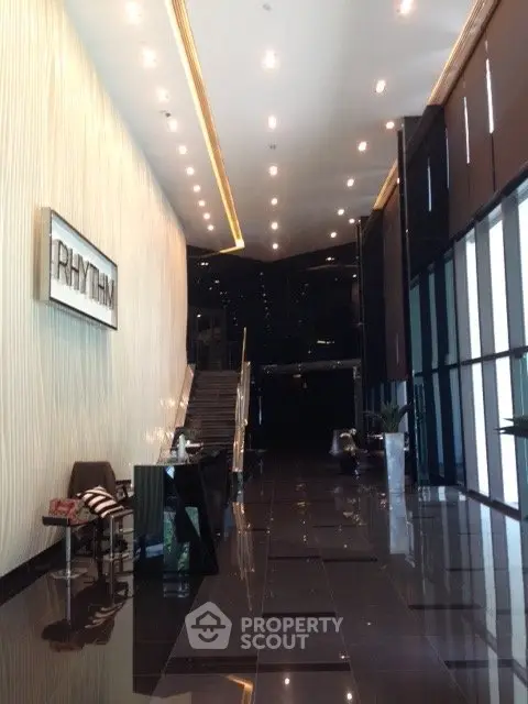 Luxurious modern building entrance with sleek design and high ceilings