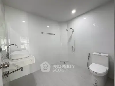 Spacious modern bathroom with sleek fixtures and minimalist design