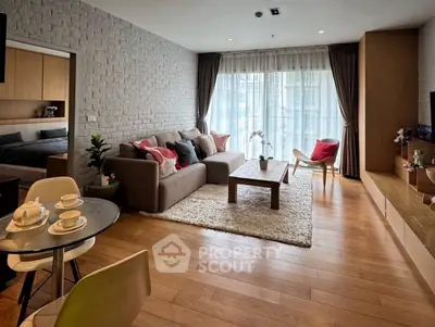 Spacious modern living room with cozy decor and natural light