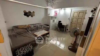 Cozy living room with modern decor and workspace setup