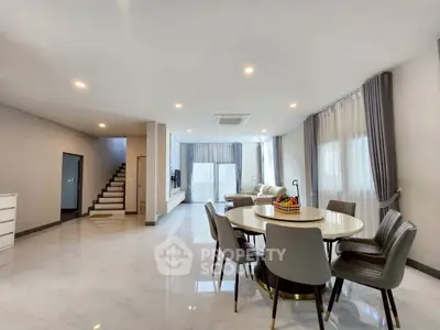 Spacious modern living room with dining area and elegant decor