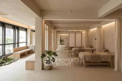 Spacious modern interior with natural light and minimalist design, perfect for relaxation or wellness activities.