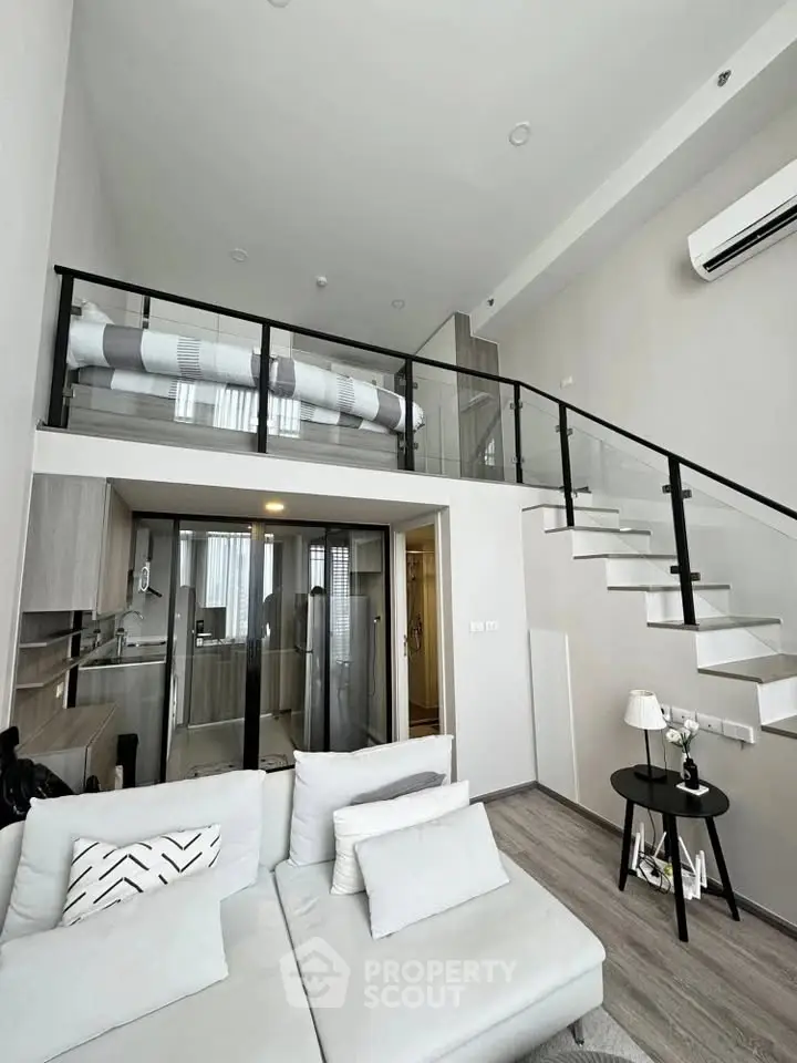 Modern loft apartment with stylish mezzanine and sleek interior design