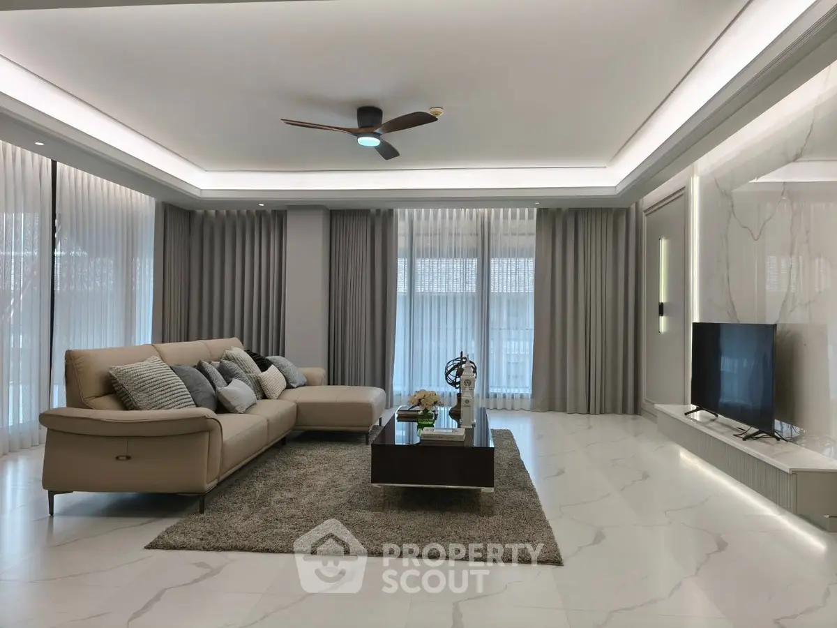 Luxurious modern living room with elegant decor and ample natural light