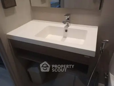 Modern bathroom with sleek white sink and contemporary fixtures