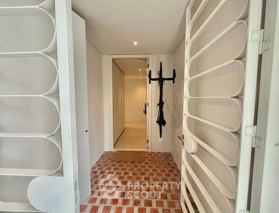 Stylish entrance with modern design and brick flooring