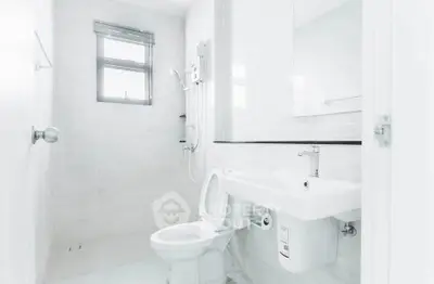Bright modern bathroom with sleek fixtures and natural light.
