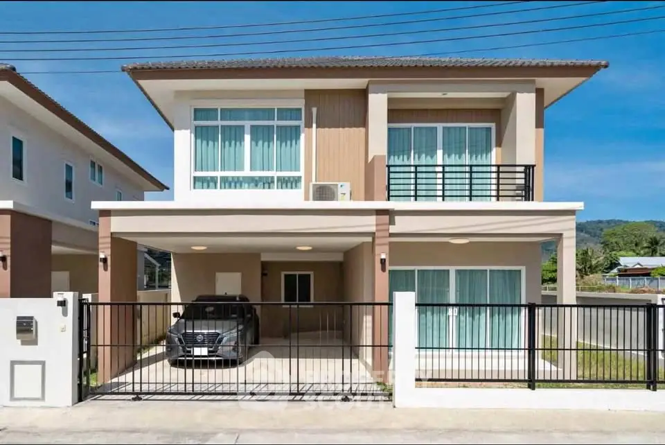Modern two-story house with carport and large windows in a suburban neighborhood.