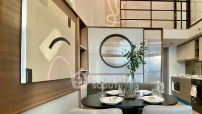 Modern dining area with stylish decor and open kitchen layout