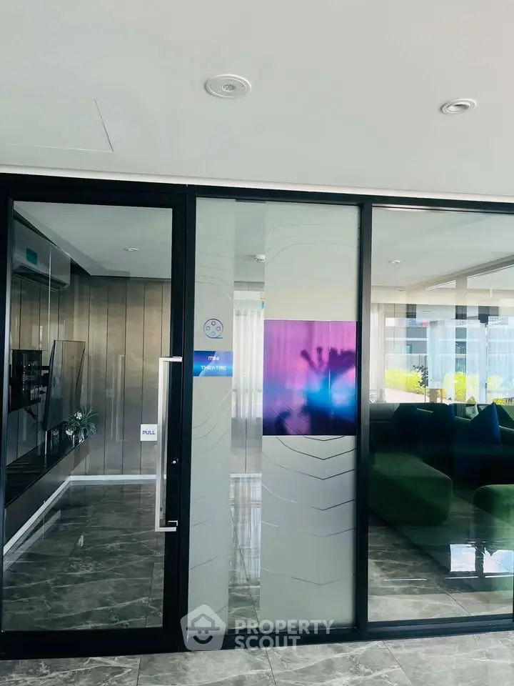 Modern lobby with glass doors and stylish interior design