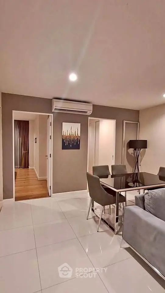 Modern living room with sleek dining area and stylish decor